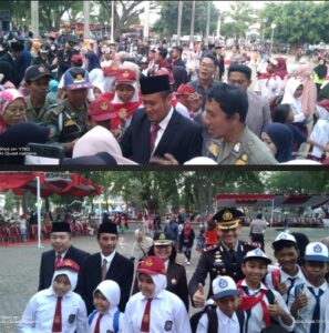 Plt Bupati bersama Kapolres Pemalang sedang berjabat tangan dan ber photo dengan ratusan para Siswa dan Siswi usai upacara di Alun-alun Kabupaten Pemalang